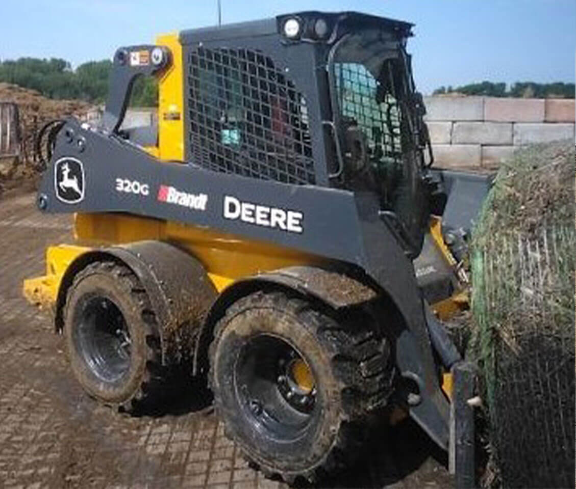 Dirty John Deere Skidloader after used with D-Fenders