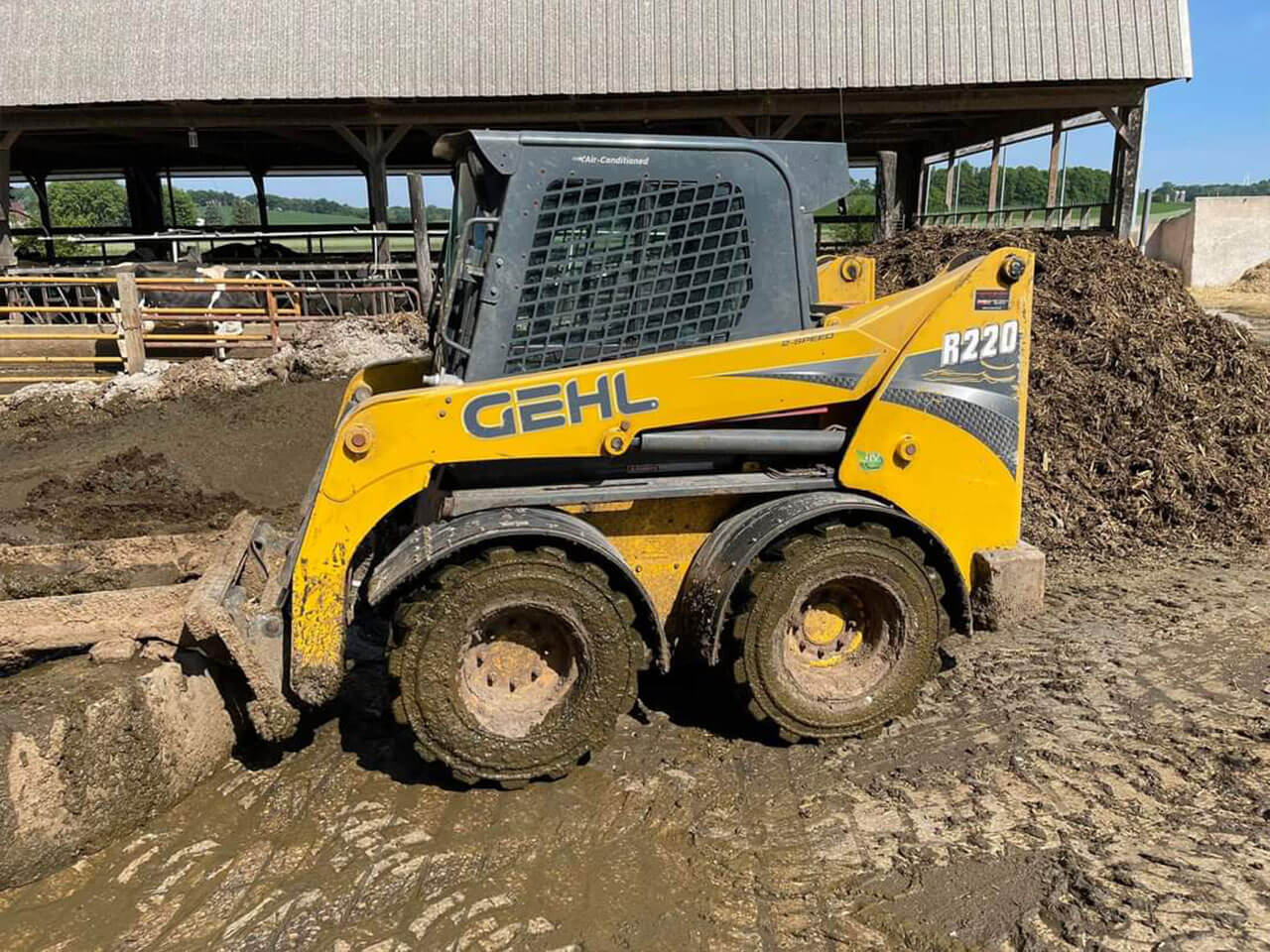 Dirty John Deere Skidloader after used with D-Fenders