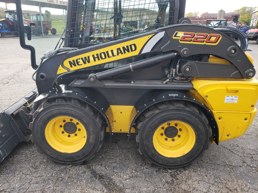New Holland L220 Vertical Lift Fender In Use
