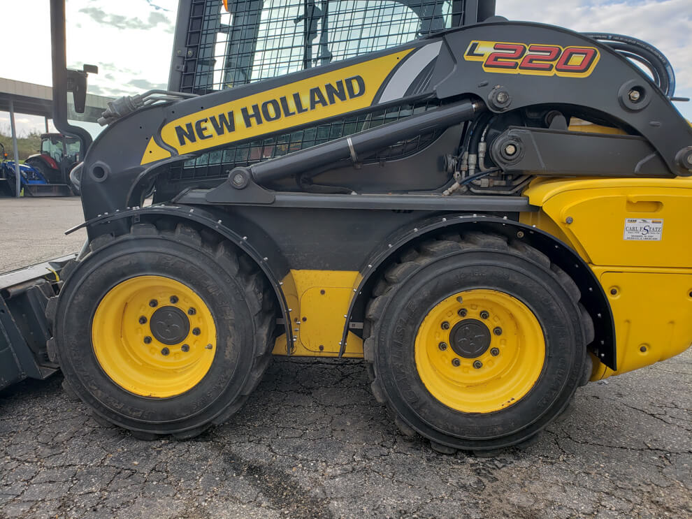 New Holland L220 Vertical Lift Fender In Use