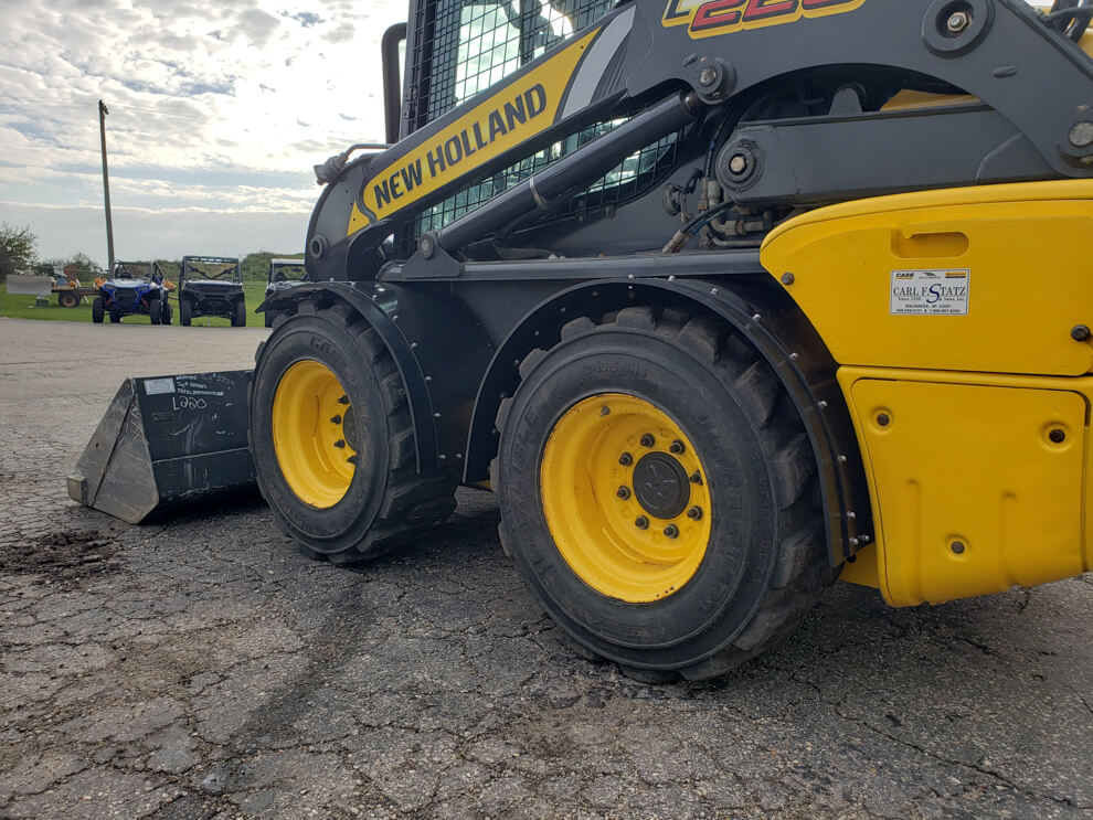 New Holland L220 Vertical Lift Fender In Use