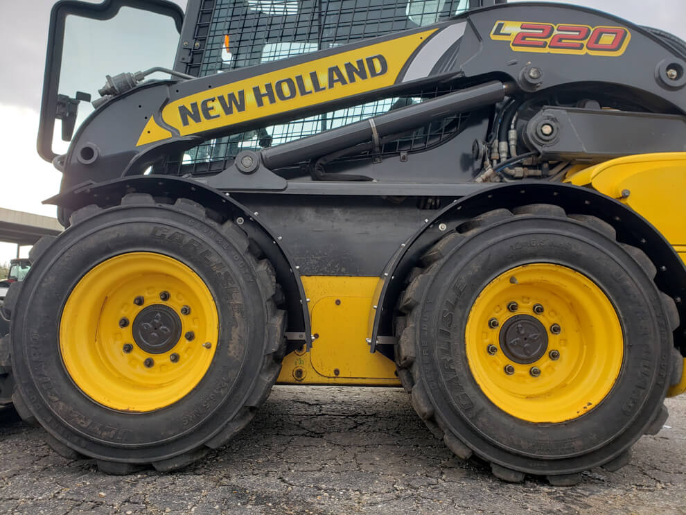 New Holland L220 Vertical Lift Fender In Use